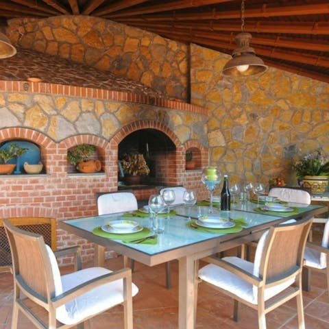 Fire up the barbecue and dine under the pergola