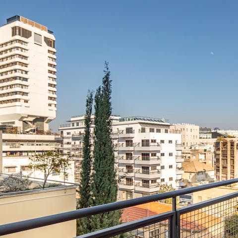 Take in sweeping views of the Tel Aviv skyline from your balcony