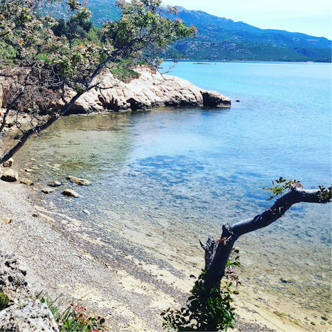 Explore the rocky coves of Lanterna beach, twenty-five minute drive away