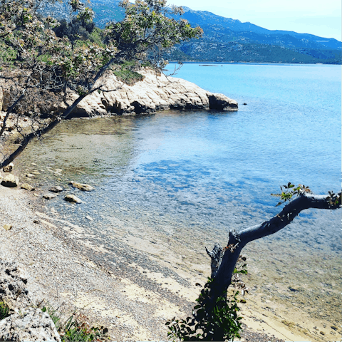 Explore the rocky coves of Lanterna beach, twenty-five minute drive away
