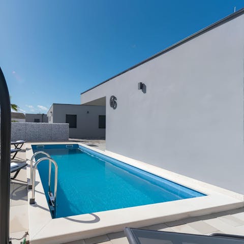 Splash around in the villa's private pool