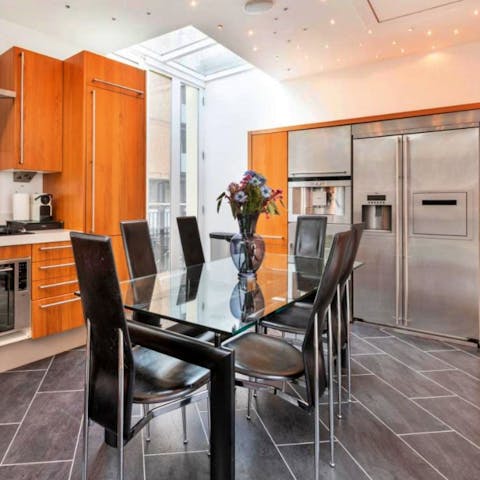 Organise delicious family feasts at the dining table in the bright kitchen