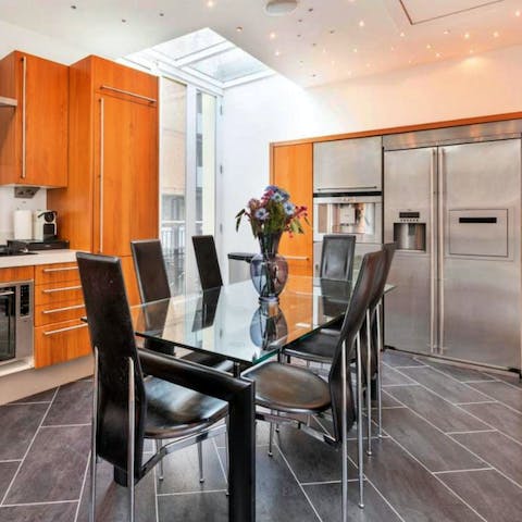Organise delicious family feasts at the dining table in the bright kitchen
