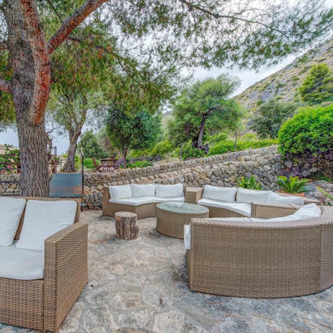 Sip cocktails as the sun sets behind the mountains