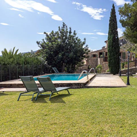 Dive into your private heated pool and soak up the sun