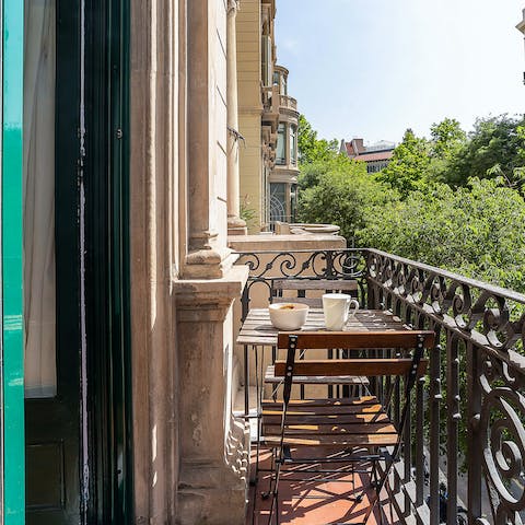 Wake up with a tree-lined boulevard view from your private balcony