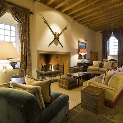 Cosy up around this magnificent fireplace