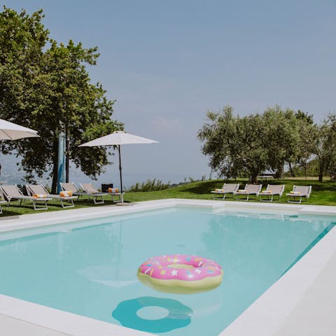 Rest on a poolside lounger with your morning coffee and pastry