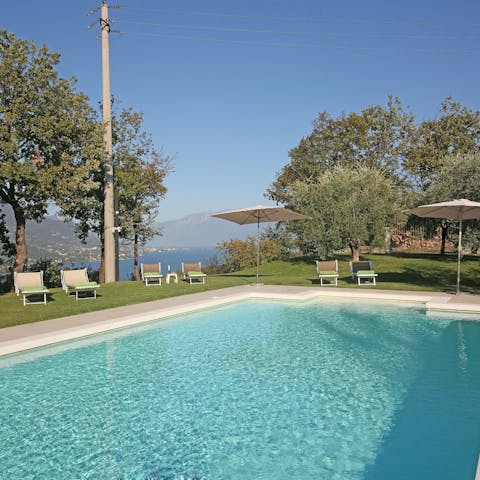 Rest on a poolside lounger with your morning coffee and pastry