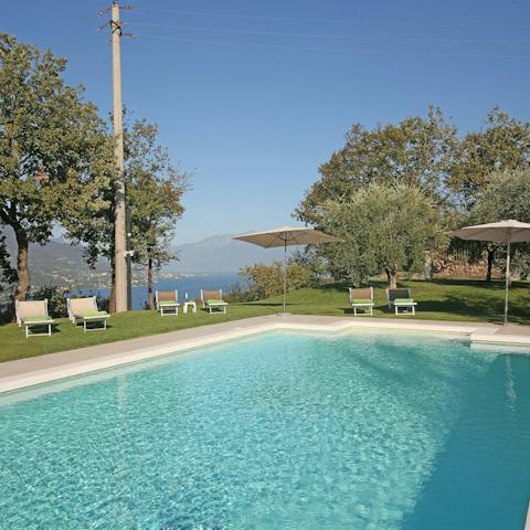Rest on a poolside lounger with your morning coffee and pastry