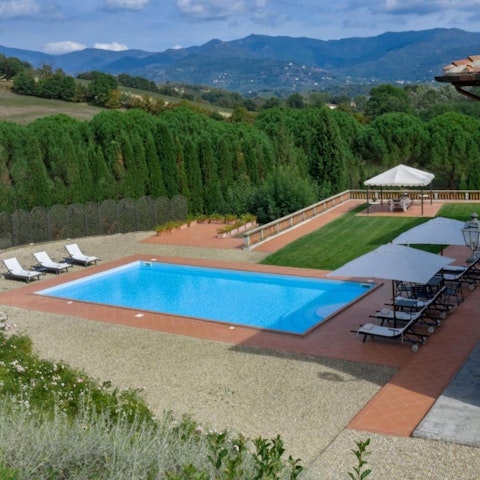 Swim lengths in the private pool with a scenic Tuscan backdrop