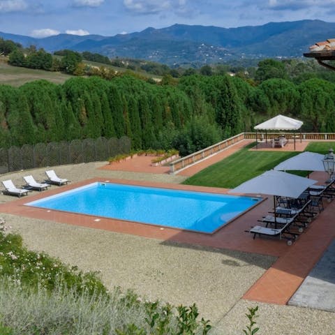 Swim lengths in the private pool with a scenic Tuscan backdrop