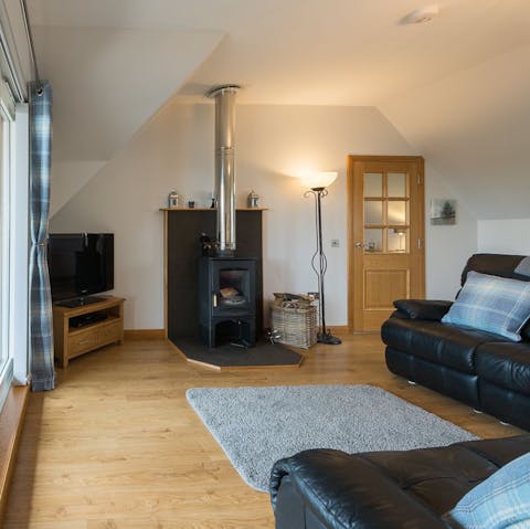 Stoke the fire in the little wood-burner on chilly evenings