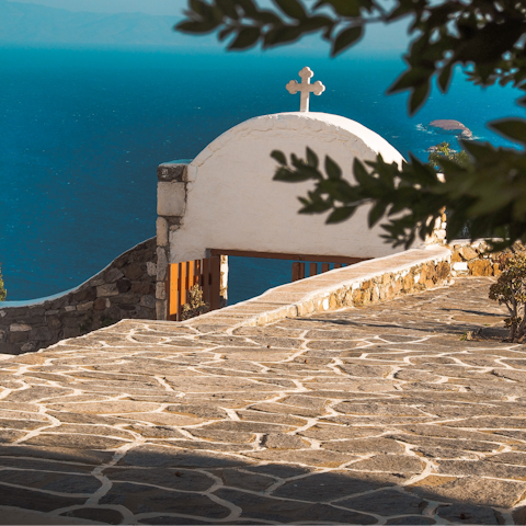 Visit the capital town of Parikia, a ten-minute drive away