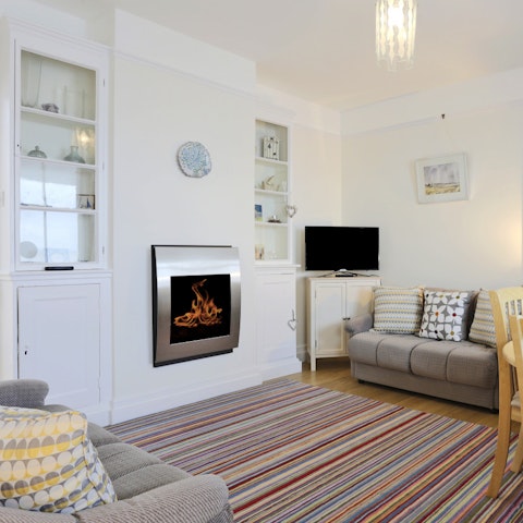 Warm your feet by the gas fireplace while you watch a movie