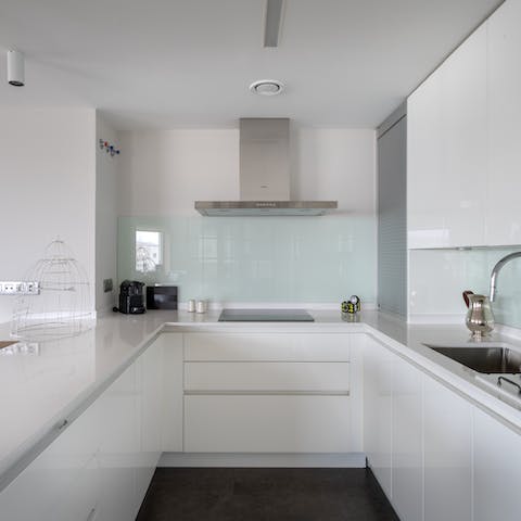 Plate up your own take of Spanish favourites in the sleek kitchen