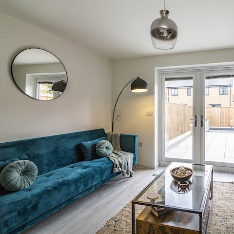 Mix a G&T and get comfortable on the velvet sofa for a great night in