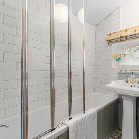 Sink into the hot waters of the bathtub after a long day of exploring