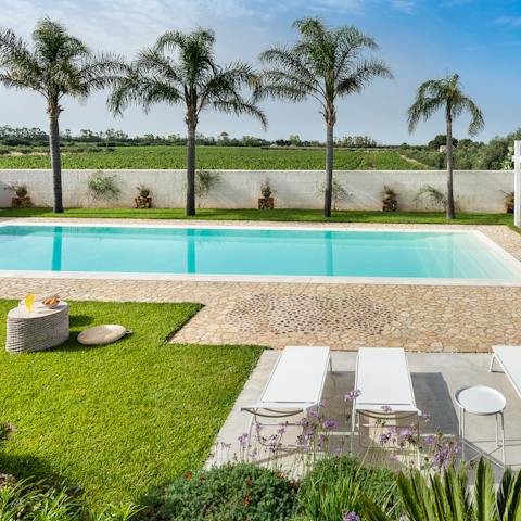 Lounge about by the glistening pool or take a refreshing dip