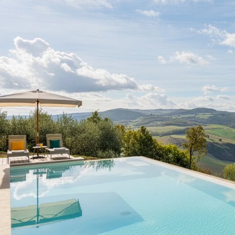 Admire the Tuscan vistas from the infinity pool