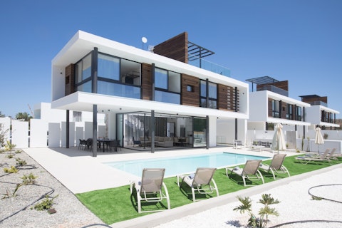 Take a dip in your private pool under clear blue skies