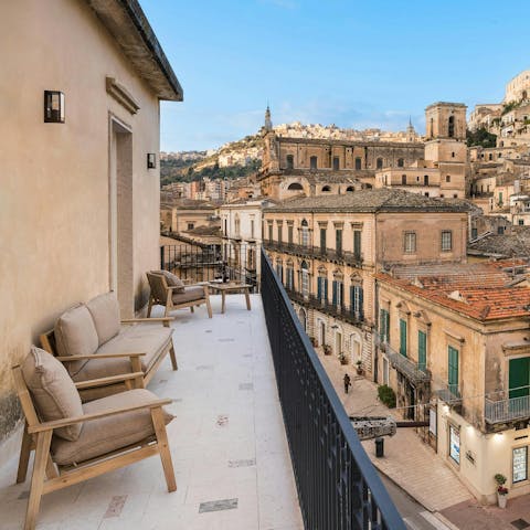 Relax on the outdoor sofa with a panoramic view of the historic town