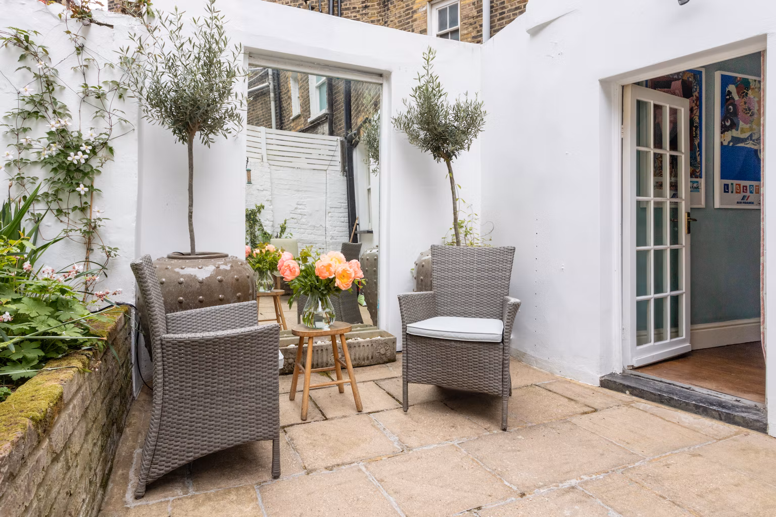 Sit in the garden with its olive trees