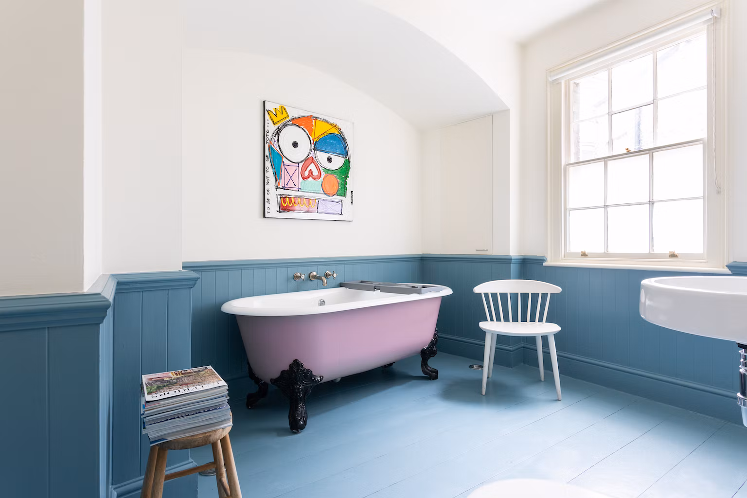 Have a soak in the mauve roll-top bath after a busy day in London