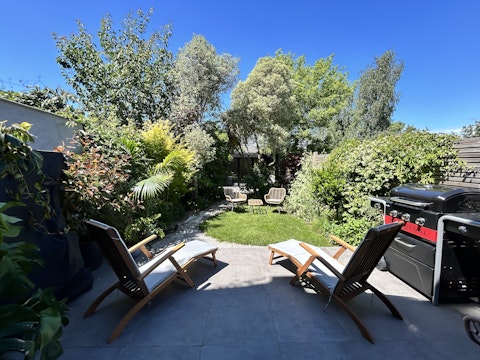 Stretch out on the terrace as the garden comes alive around you