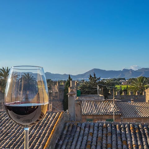 Head up to the roof terrace for sunset drinks and admire the panoramic views