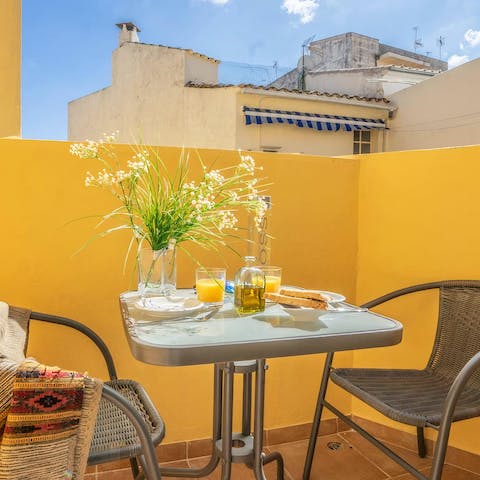 Start the day with coffee and pastries on the main bedroom's balcony