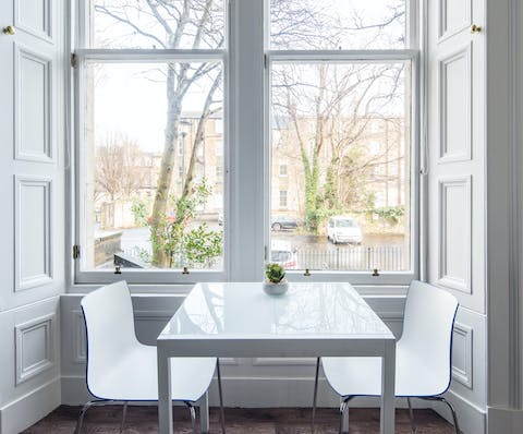 Take in the street view from the breakfast table in the kitchen