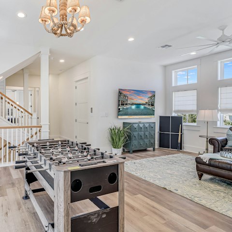 Unwind with a game of table football in the second living room