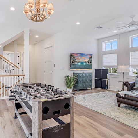 Unwind with a game of table football in the second living room