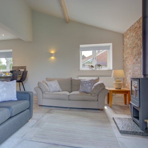 Get warm and toasty by the wood burner and break out the home's board games