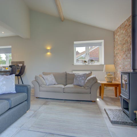 Get warm and toasty by the wood burner and break out the home's board games