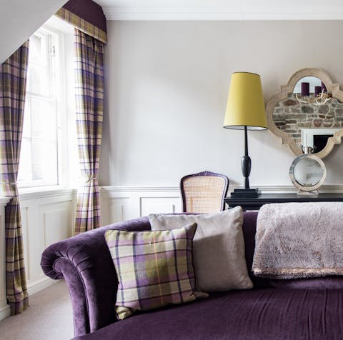 Curl up on the plush sofa with a glass of scotch and a good book
