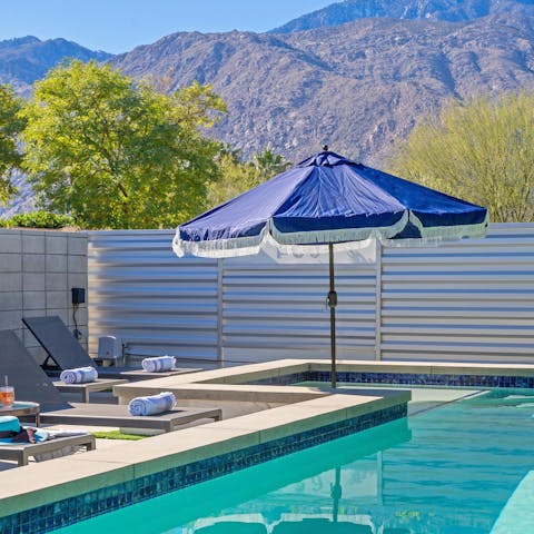 Swim in the private pool with mountain views