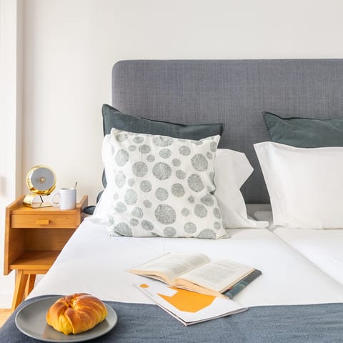 The grey hues in this bedroom