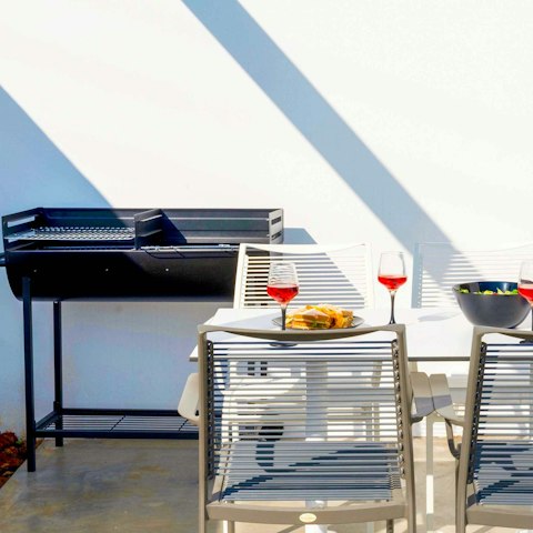 Set the table ahead of an alfresco feast as the barbecue sizzles away