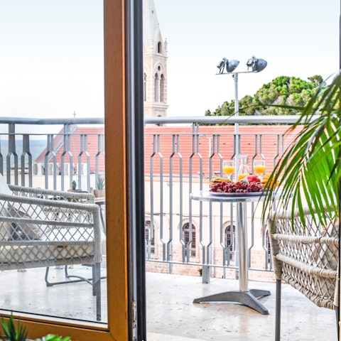 Enjoy breakfast on your private balcony with sea views