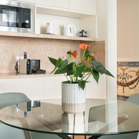 Enjoy some chicken piri piri at the elegant glass-top dining table