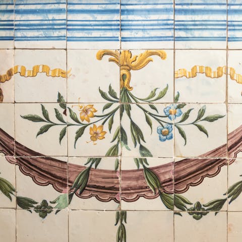 Admire the original painted tiles