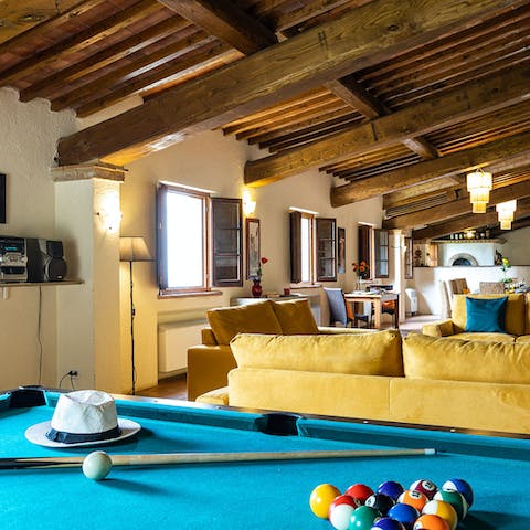 Set up a game of pool to cool off indoors