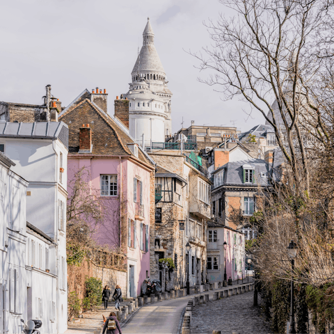 Take the Metro to Abbesses and climb through Montmartre