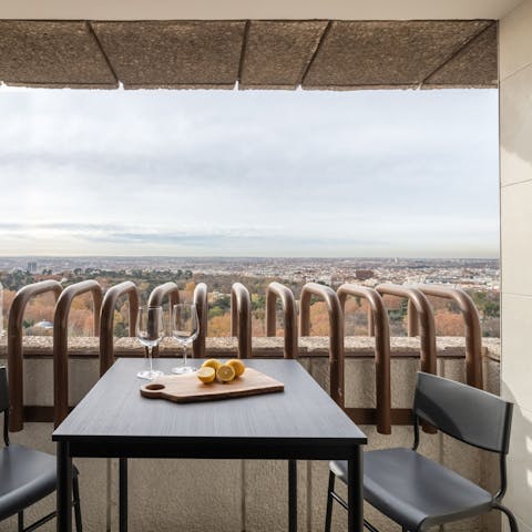 Sip sangria on the private balcony with views across Madrid