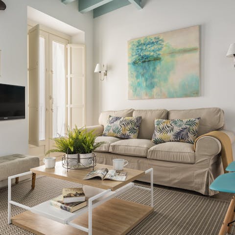 Open the living area's French doors to enjoy the balmy breeze