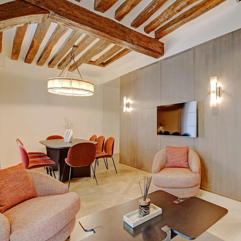 Gather on the sofas or at the dining table – there's space for everyone