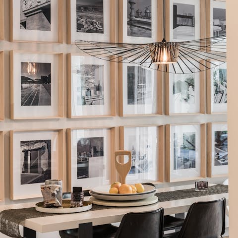 Sit down to an elegant meal in the beautiful photograph-decorated dining room