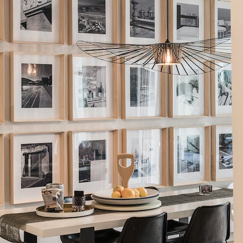 Sit down to an elegant meal in the beautiful photograph-decorated dining room